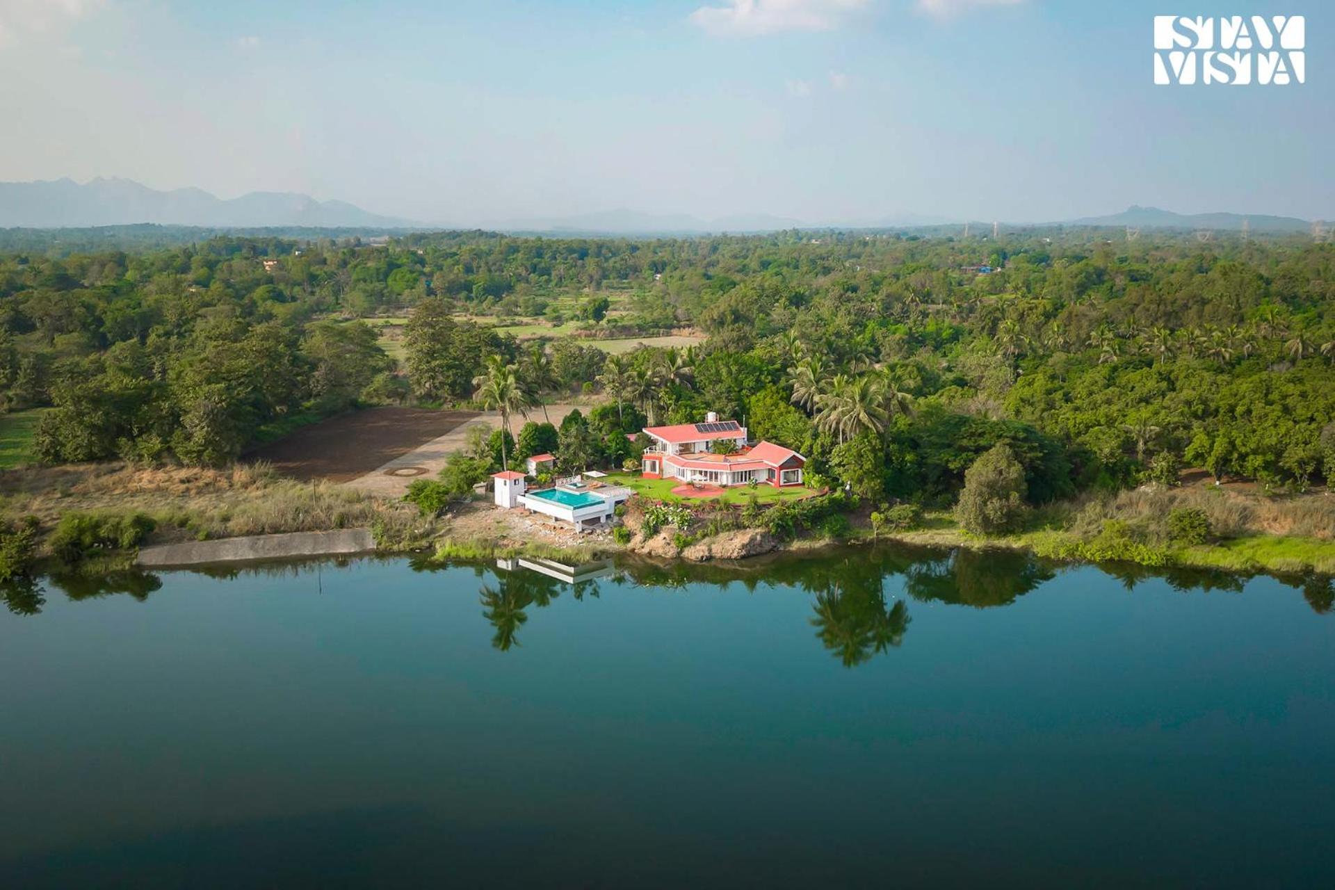 StayVista's Waterway Retreat - Lakeside Oasis with Infinity Pool