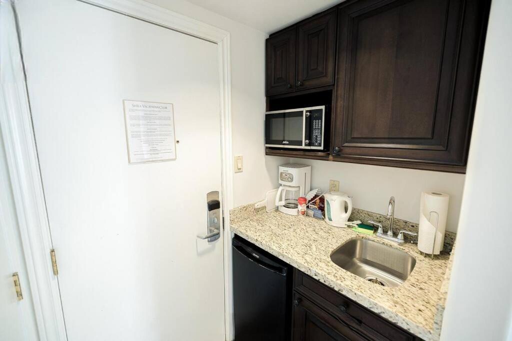 Relax & Rejuvenate at 2BR Retreat with Pool & Gym
