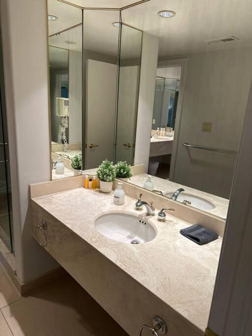 Relax & Rejuvenate at 2BR Retreat with Pool & Gym