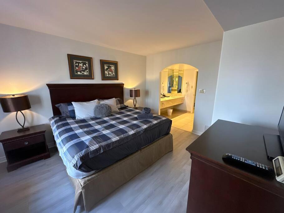 Relax & Rejuvenate at 2BR Retreat with Pool & Gym