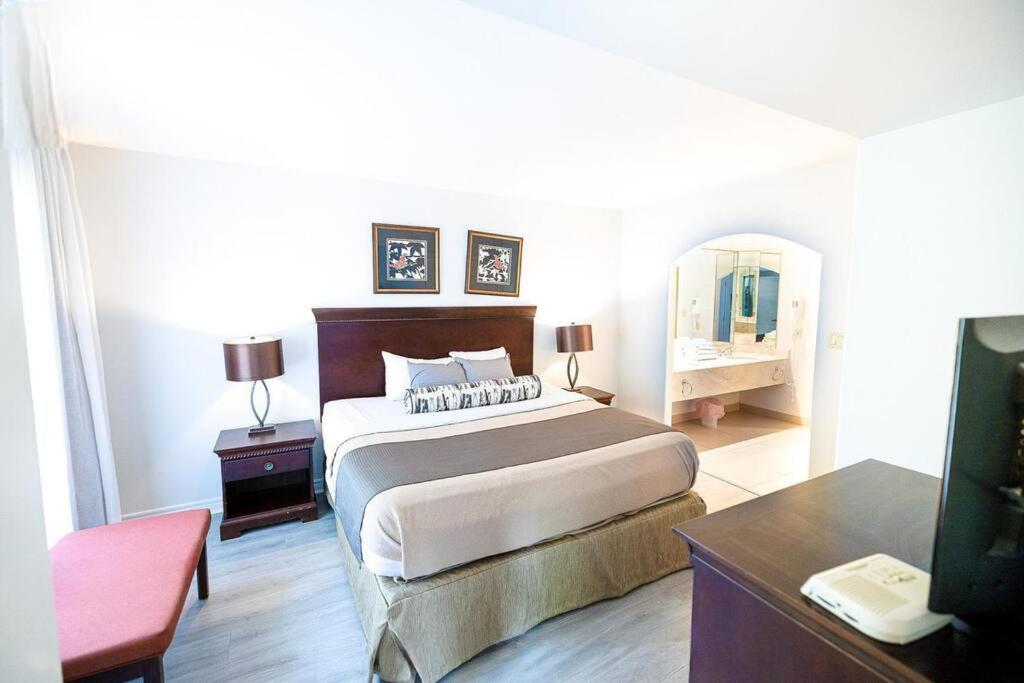 Relax & Rejuvenate at 2BR Retreat with Pool & Gym