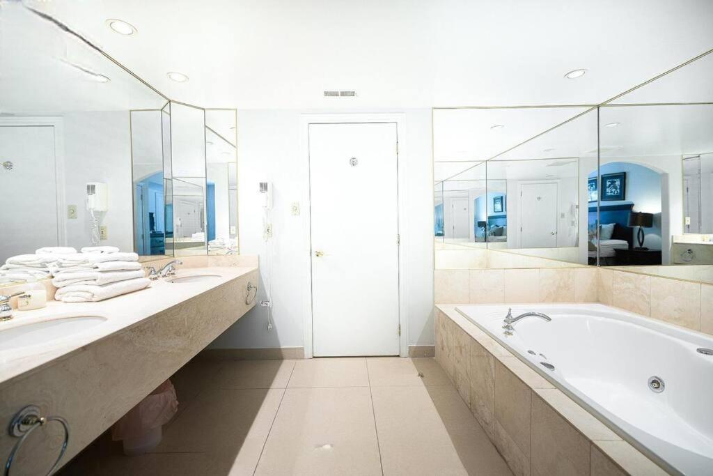 Relax & Rejuvenate at 2BR Retreat with Pool & Gym