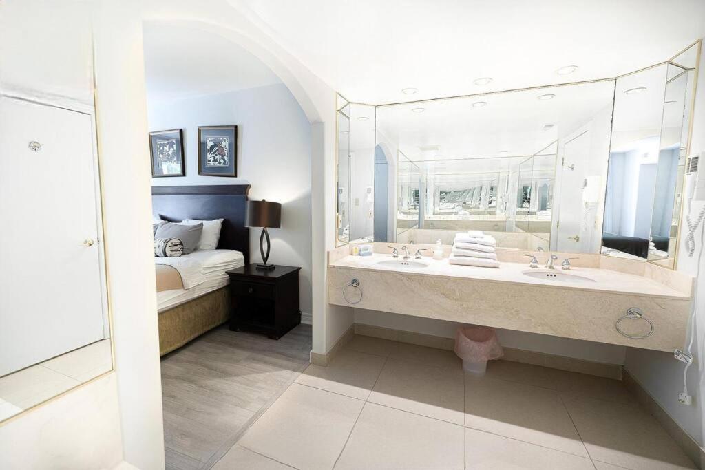 Relax & Rejuvenate at 2BR Retreat with Pool & Gym