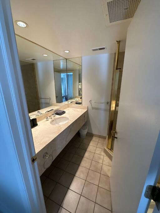 Relax & Rejuvenate at 2BR Retreat with Pool & Gym