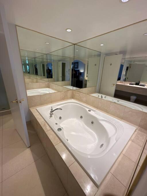 Relax & Rejuvenate at 2BR Retreat with Pool & Gym