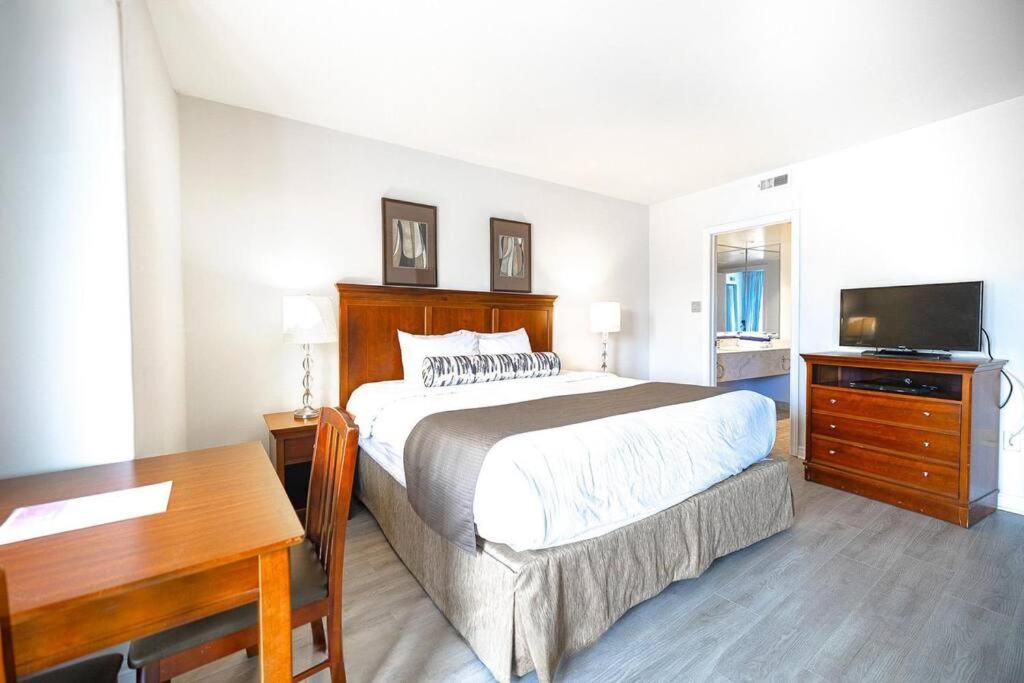 Relax & Rejuvenate at 2BR Retreat with Pool & Gym