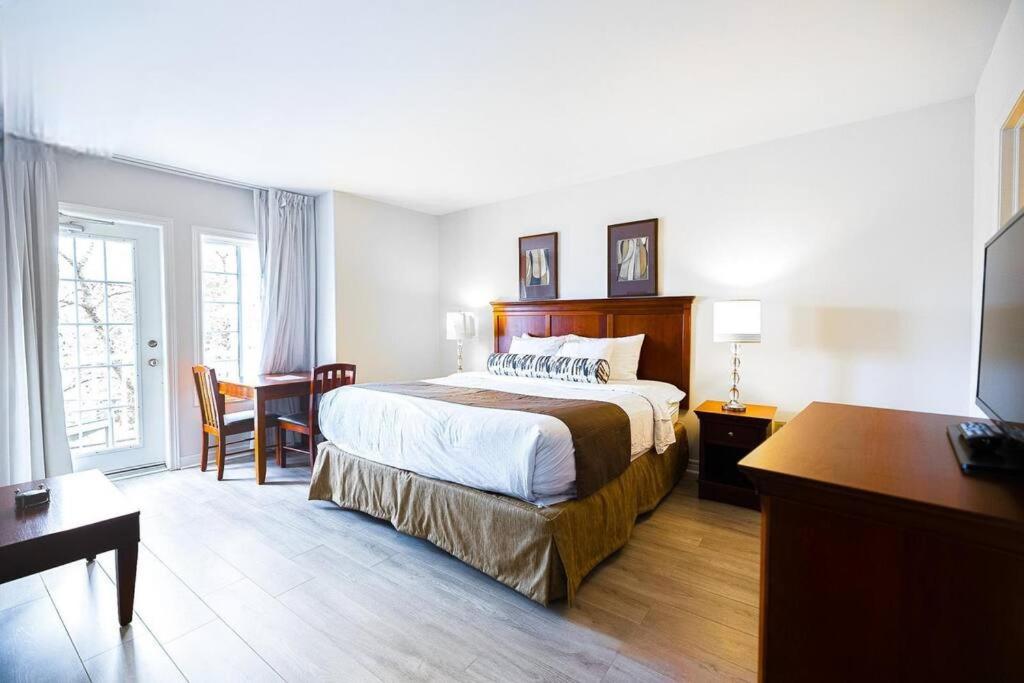 Relax & Rejuvenate at 2BR Retreat with Pool & Gym