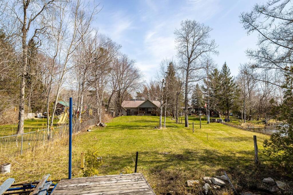 Waterfront Cottage with Sunsets, BBQ and Yard