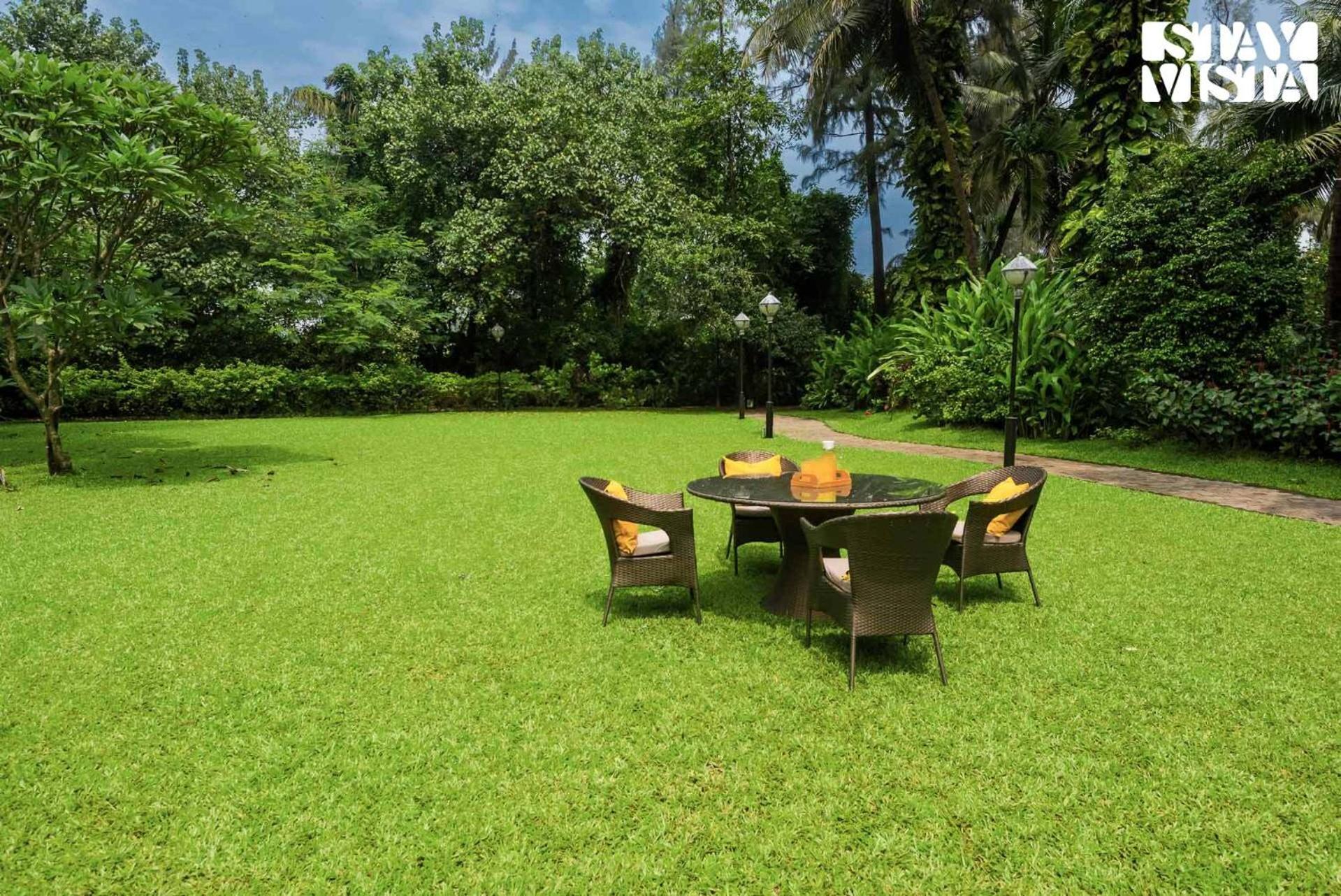 Sea Breeze by StayVista - Beachside bliss with a splash of creativity with Pool, gazebo, lush lawn, and an artistically inspired house view 3