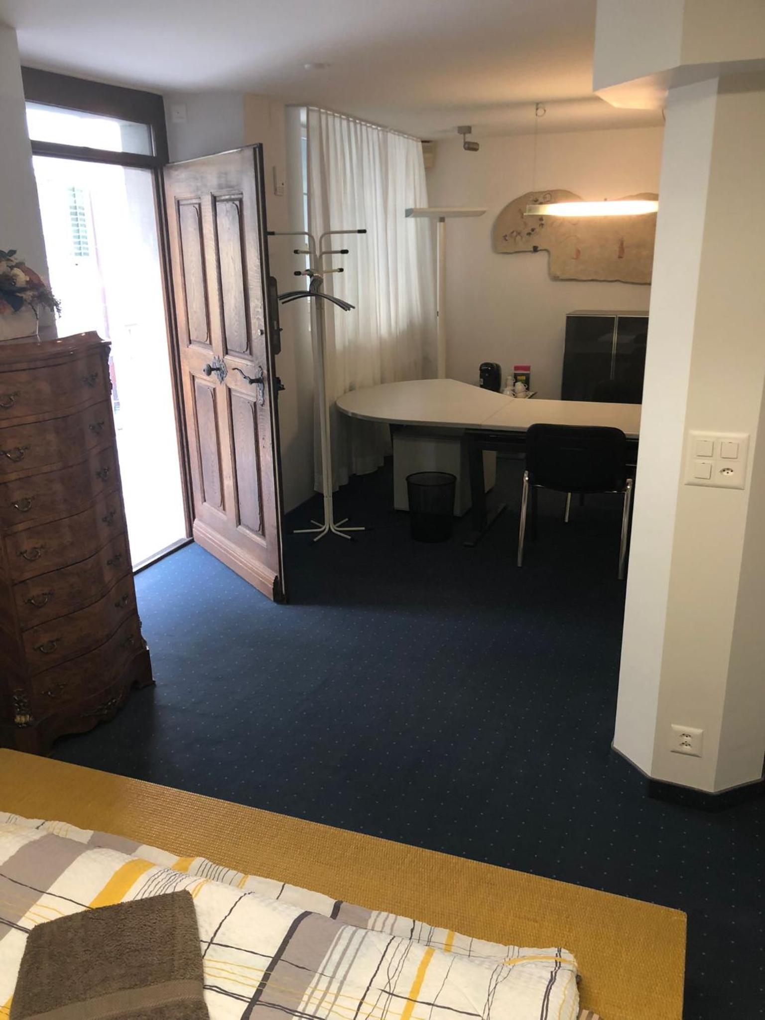 Bedroom cum office with shared shower in Zug's Old Town
