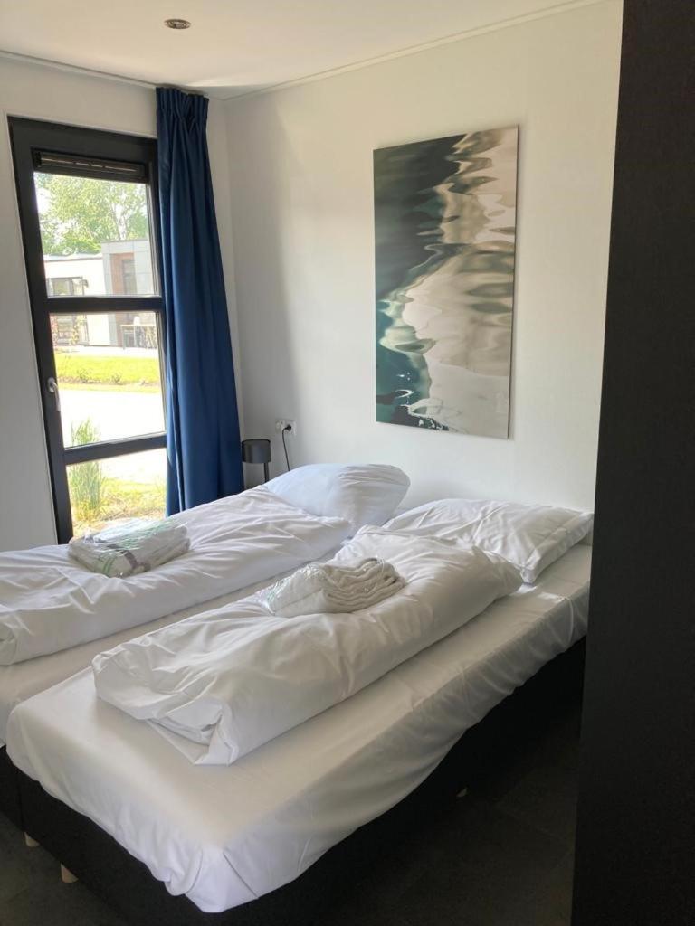Enkhuizer Strand Chalet Strandpanorama Zweite Reihe mit Zaun Hausnr 203 view 4
