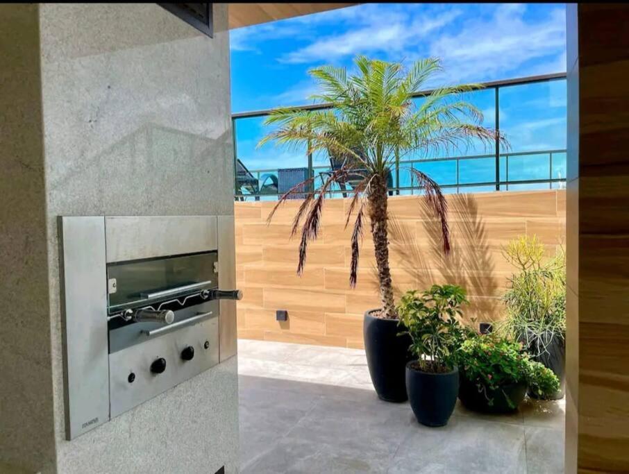 Flat com Rooftop à 100metros das Piscinas Naturais