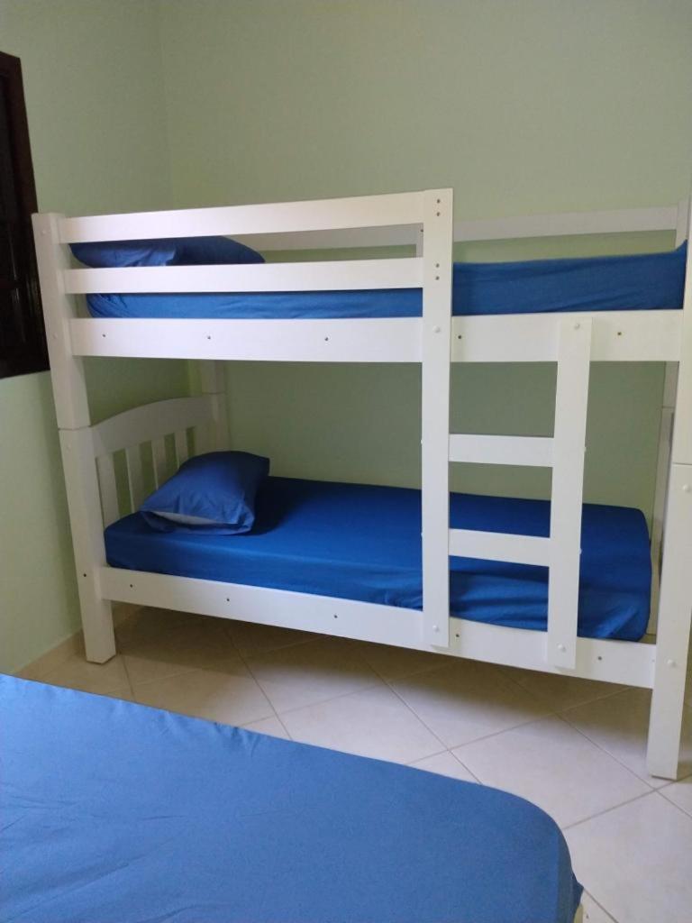 Casa Gomes com 3 suítes e ar-condicionado até 12 pessoas em Ubatuba Itaguá