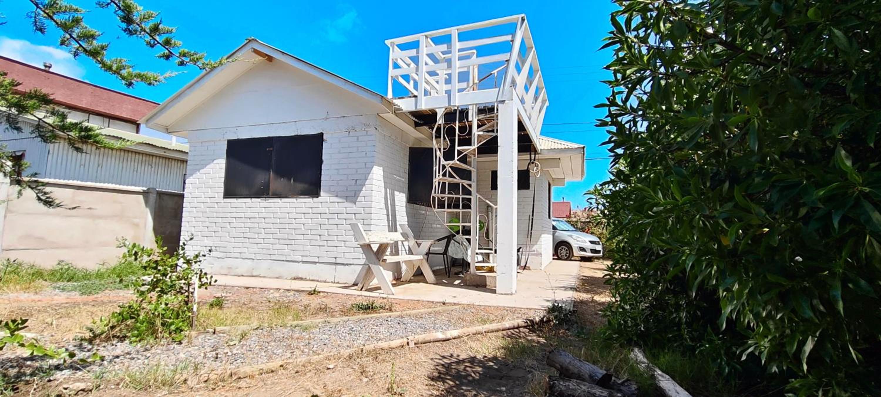 Encantadora Casa con Balcón a Pasos del Mar