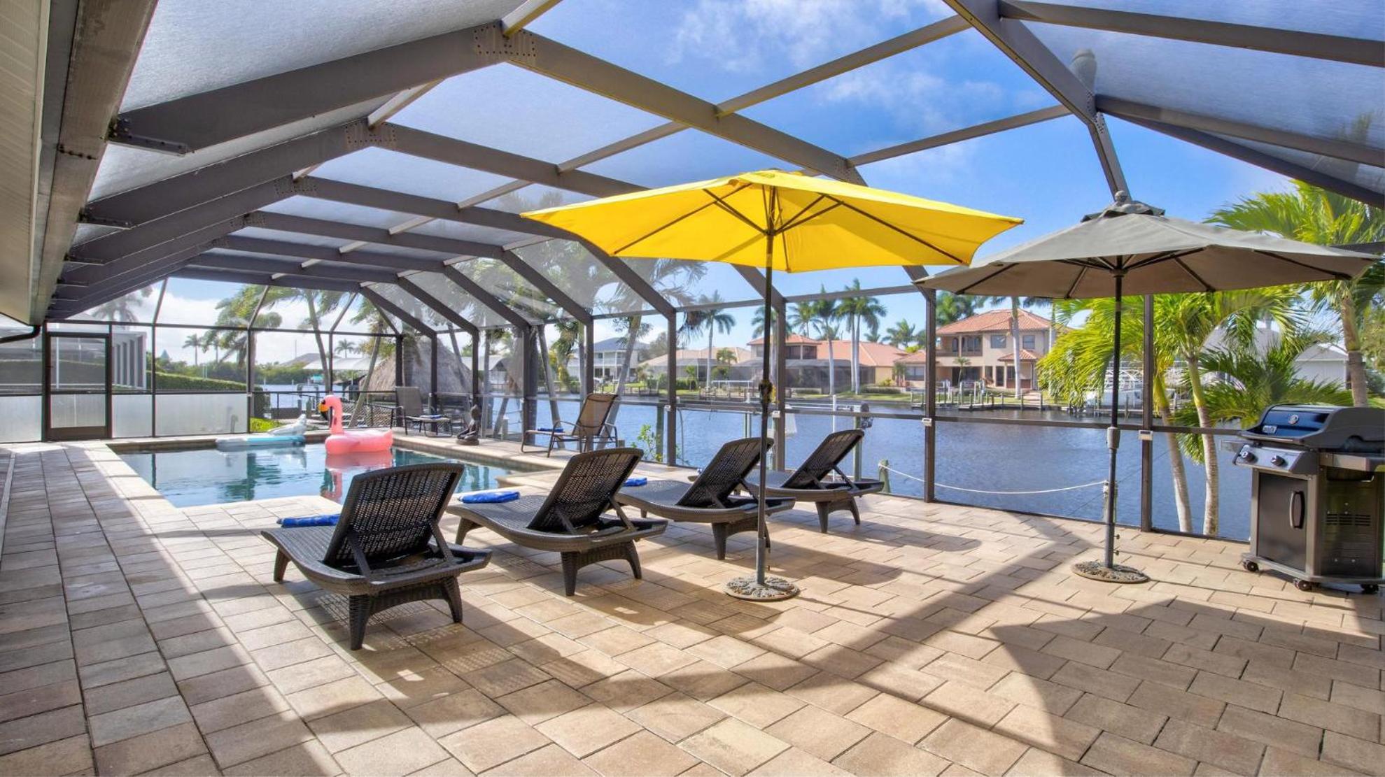 Nicely Decorated Pool Home On Canal With Boat Dock view 3