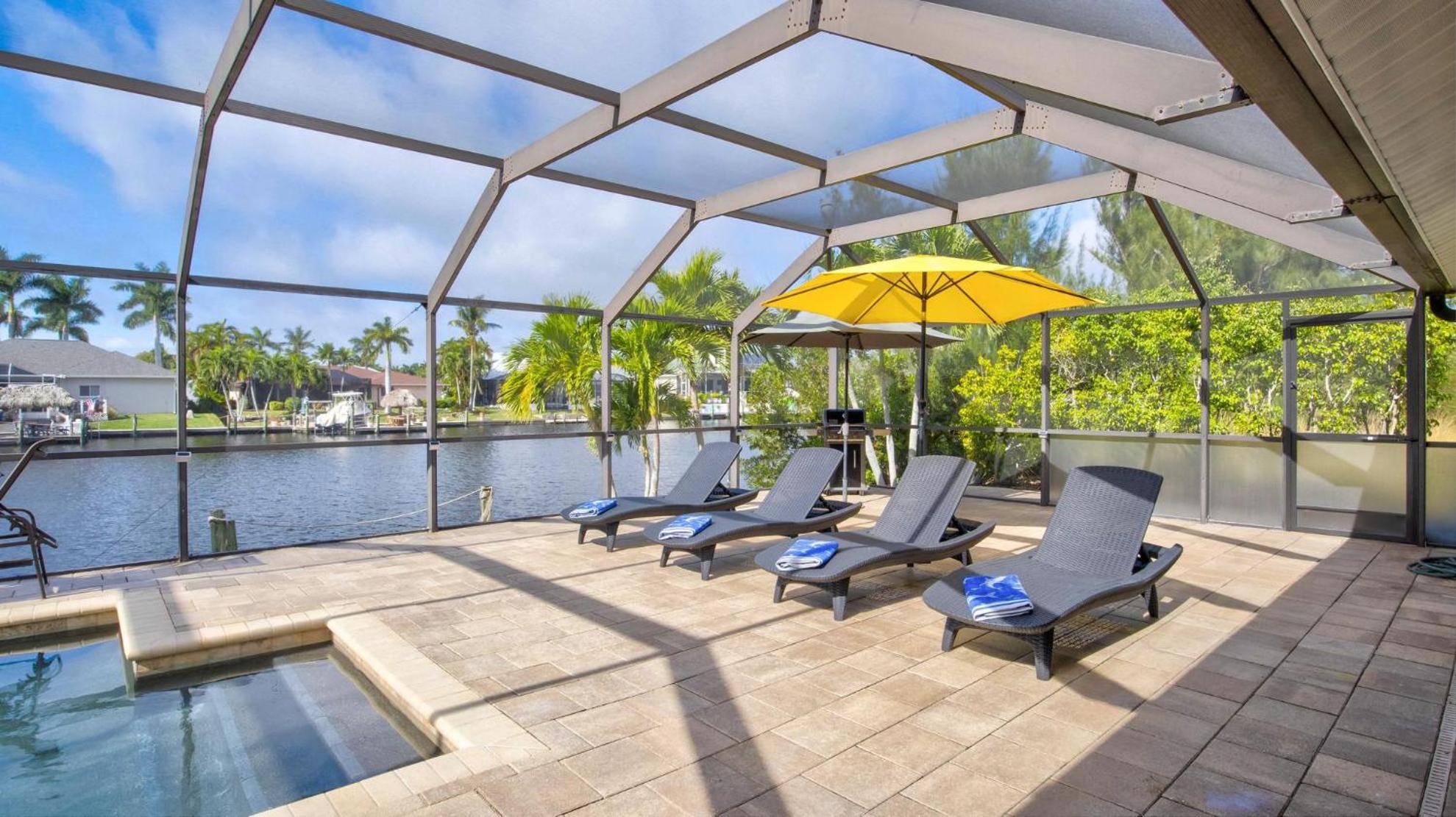Nicely Decorated Pool Home On Canal With Boat Dock view 4