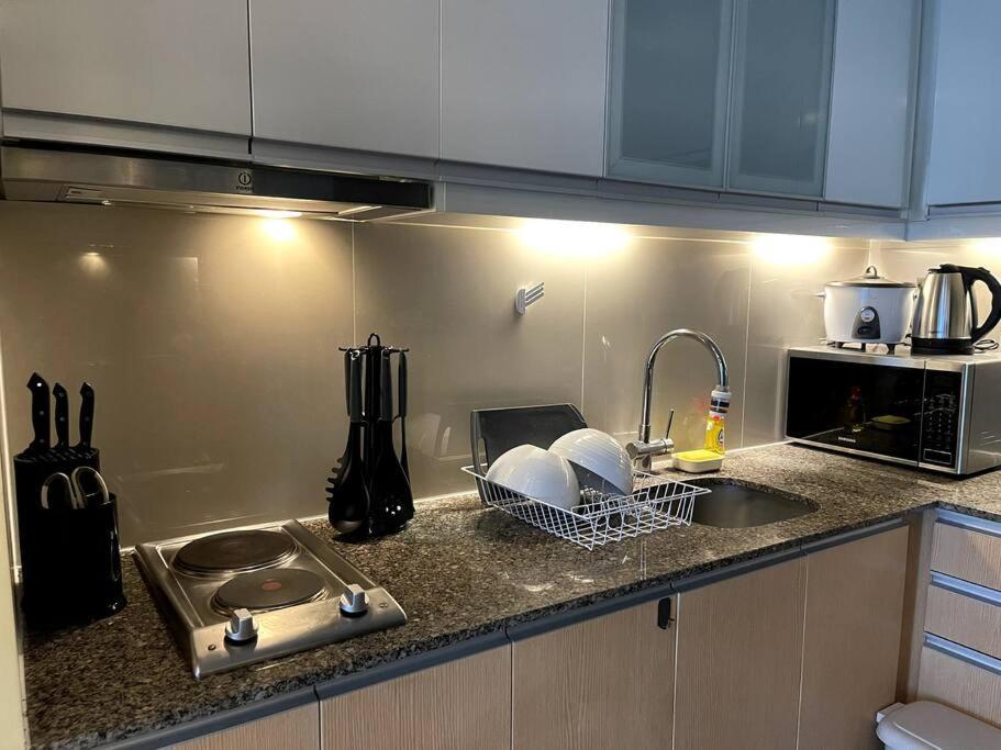 Escape 1BR One Uptown BGC w/ Sound System view 2