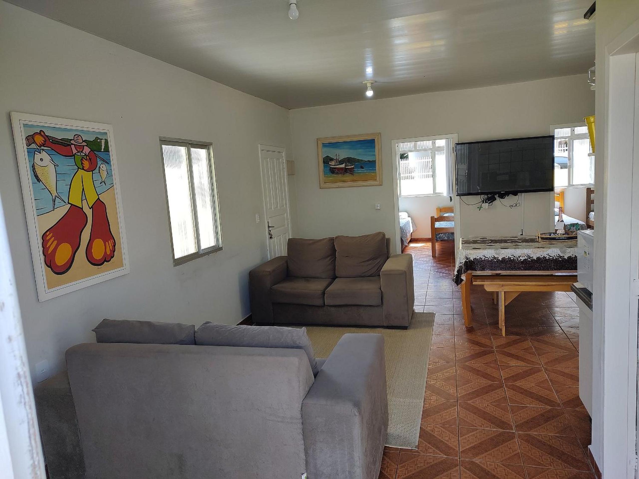 Casa pé na areia com vista especial do pôr do sol.
