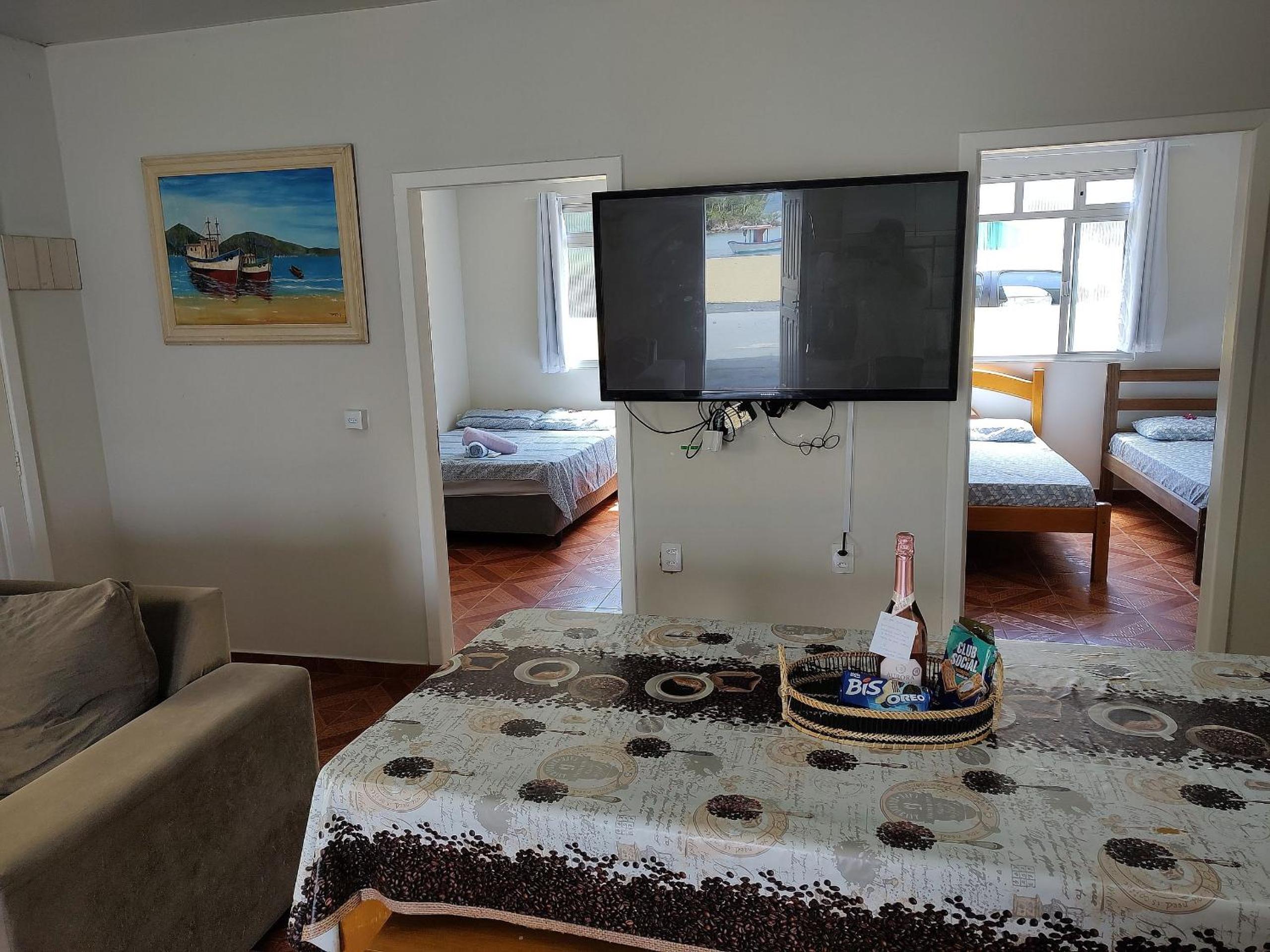 Casa pé na areia com vista especial do pôr do sol.