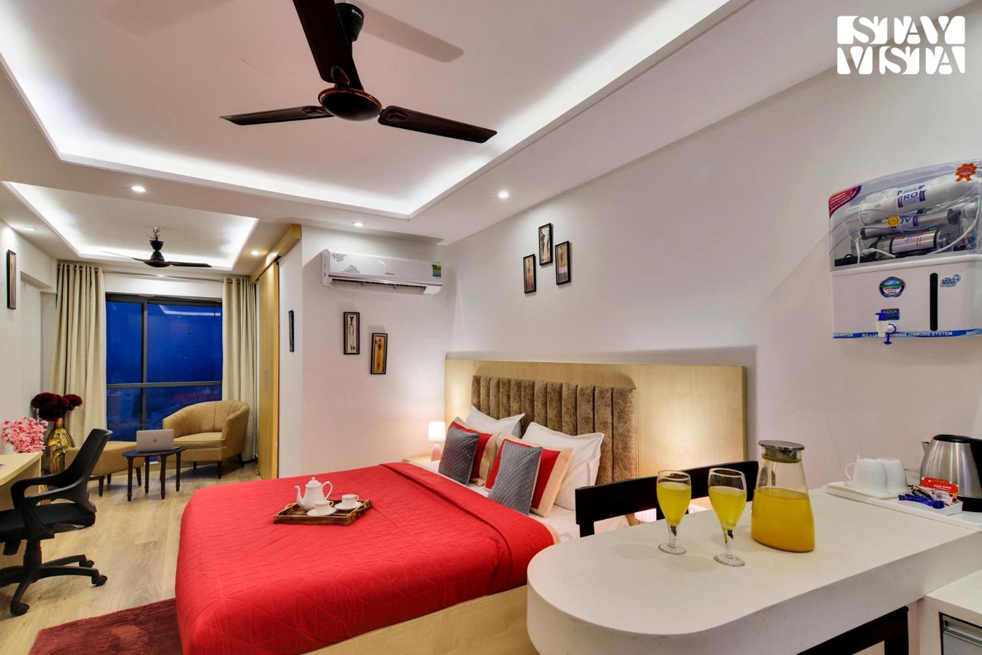 StayVista's Skyline Studio Apartments - Urban Oasis with Terrace, Gym & Bar