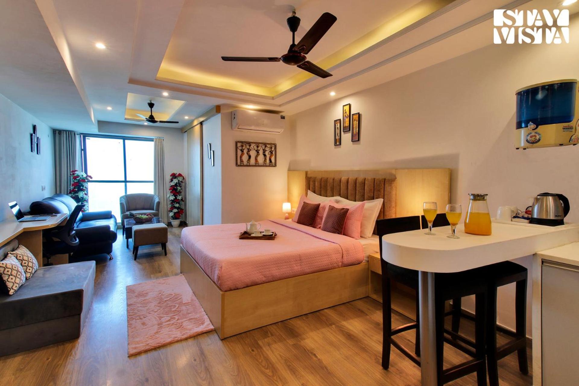 StayVista's Skyline Studio Apartments - Urban Oasis with Terrace, Gym & Bar