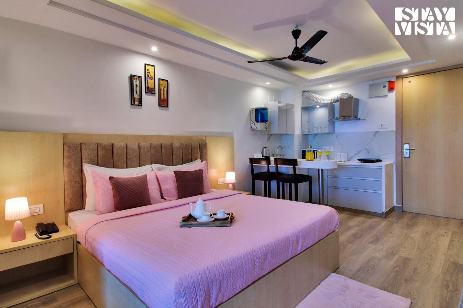 StayVista's Skyline Studio Apartments - Urban Oasis with Terrace, Gym & Bar