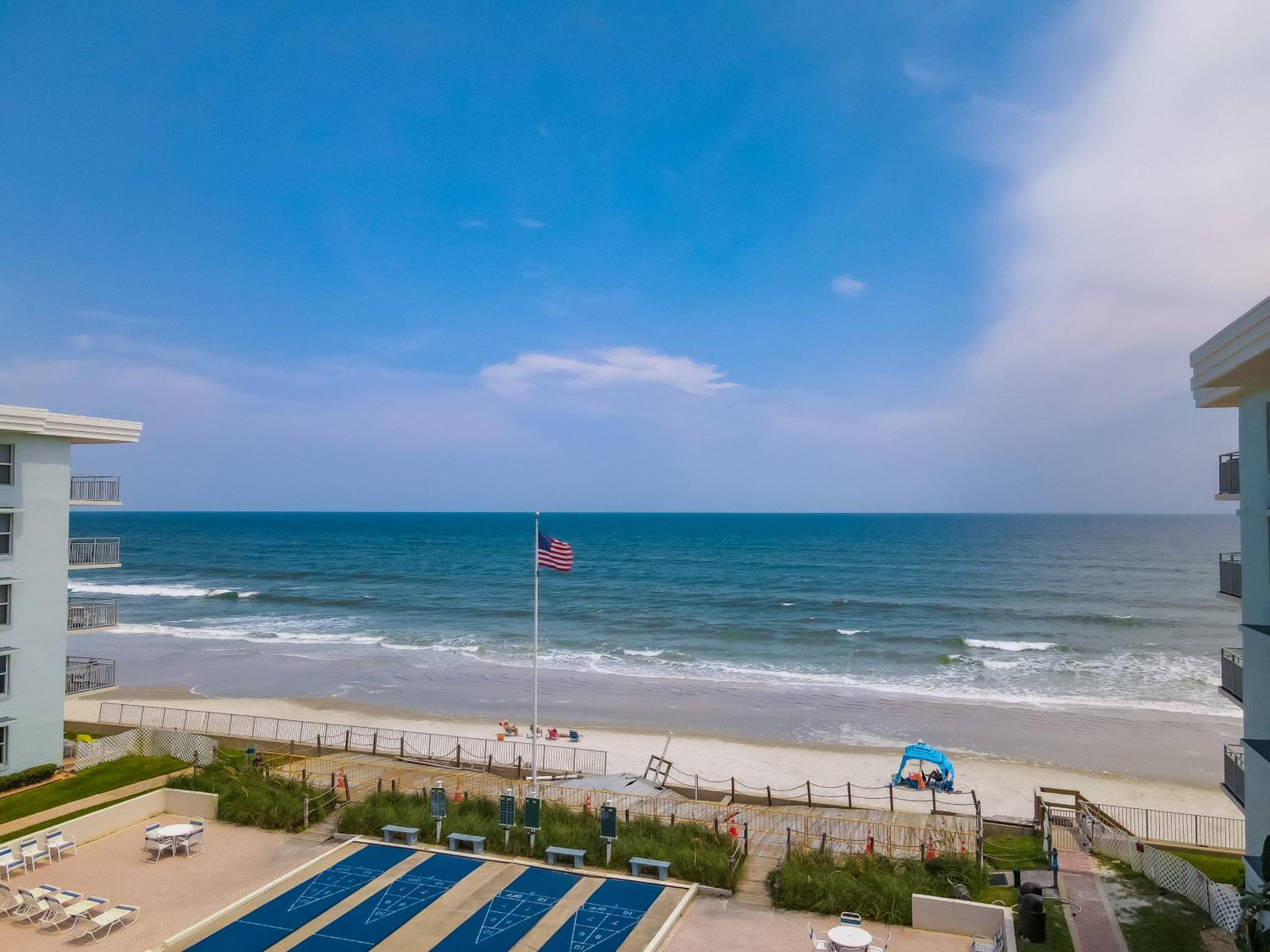 Stunning coastal condo with ocean and pool views from the balcony!