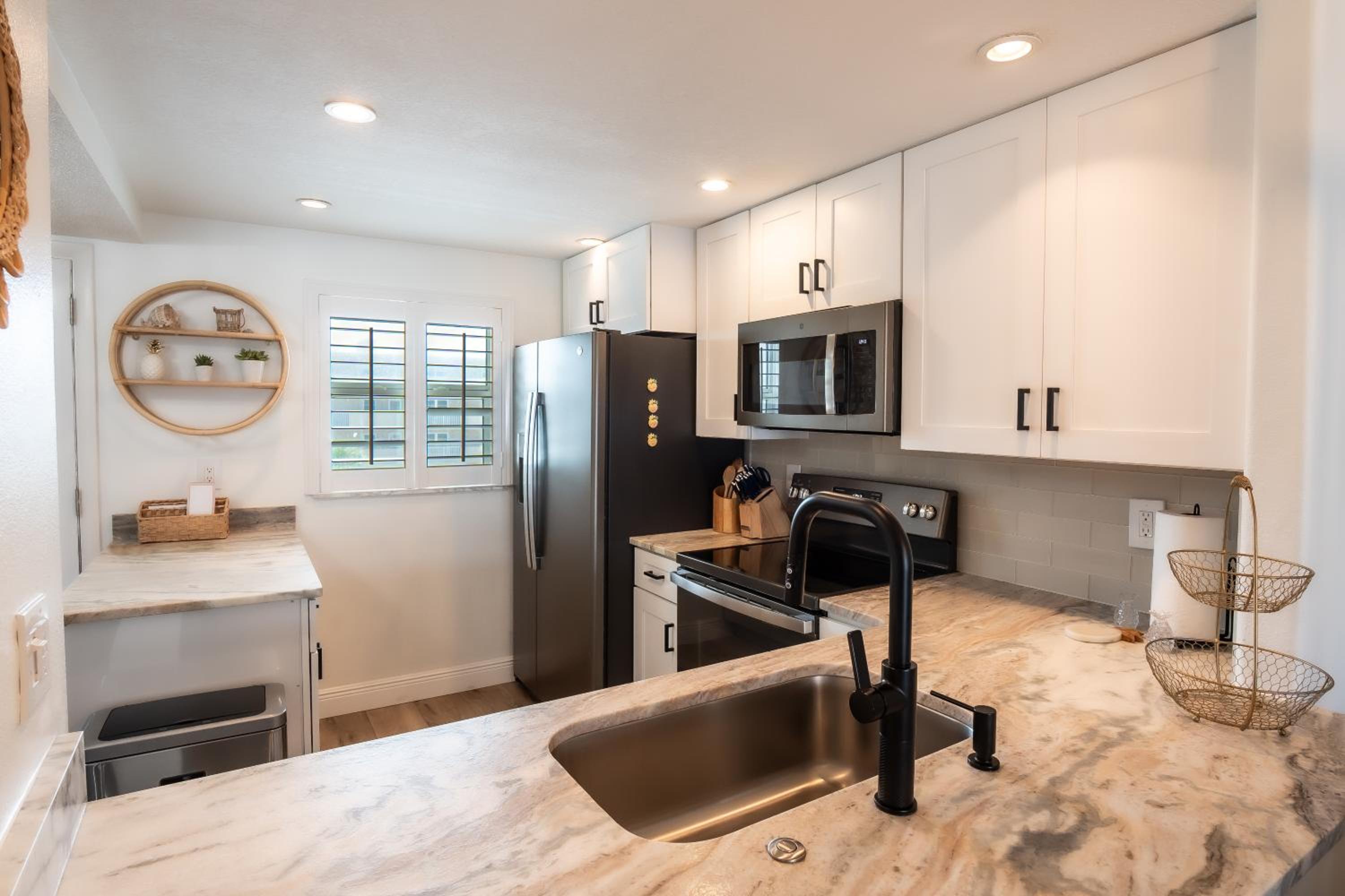 Stunning coastal condo with ocean and pool views from the balcony!