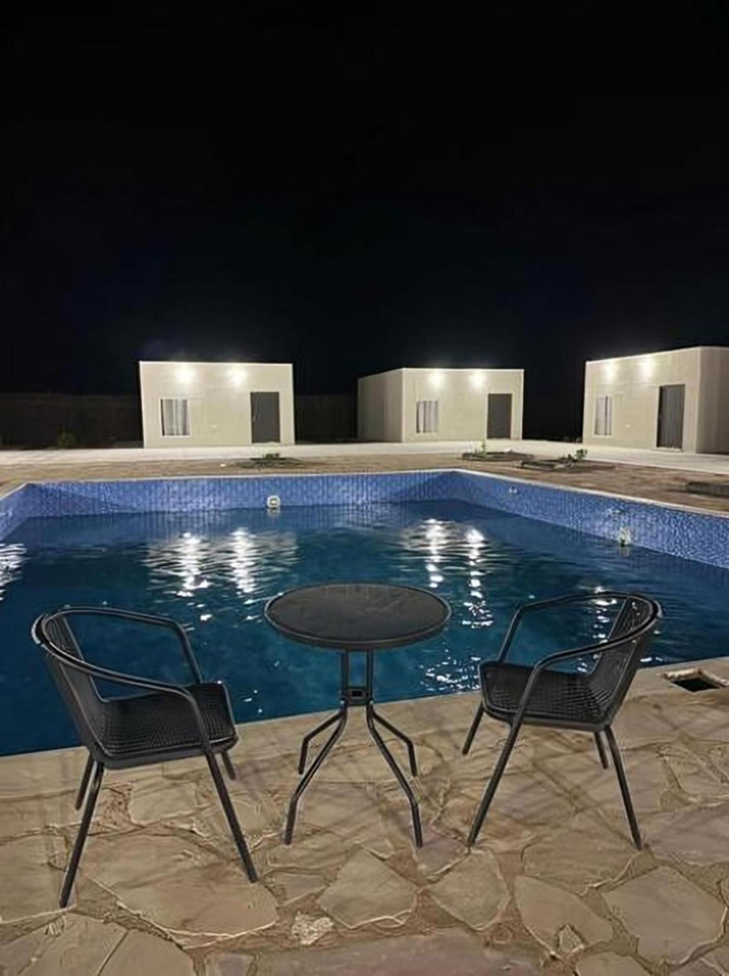 Studio overlooking pool amid flowering and quiet