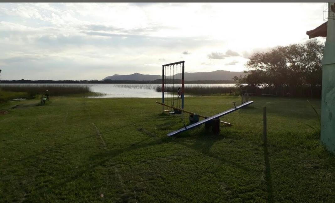 Casa na lagoa do Palmital com acesso à lagoa na propriedade e localizada apenas a 13 km da praia de Atlântida Sul e do Centro de Osório Lugar com Natureza-