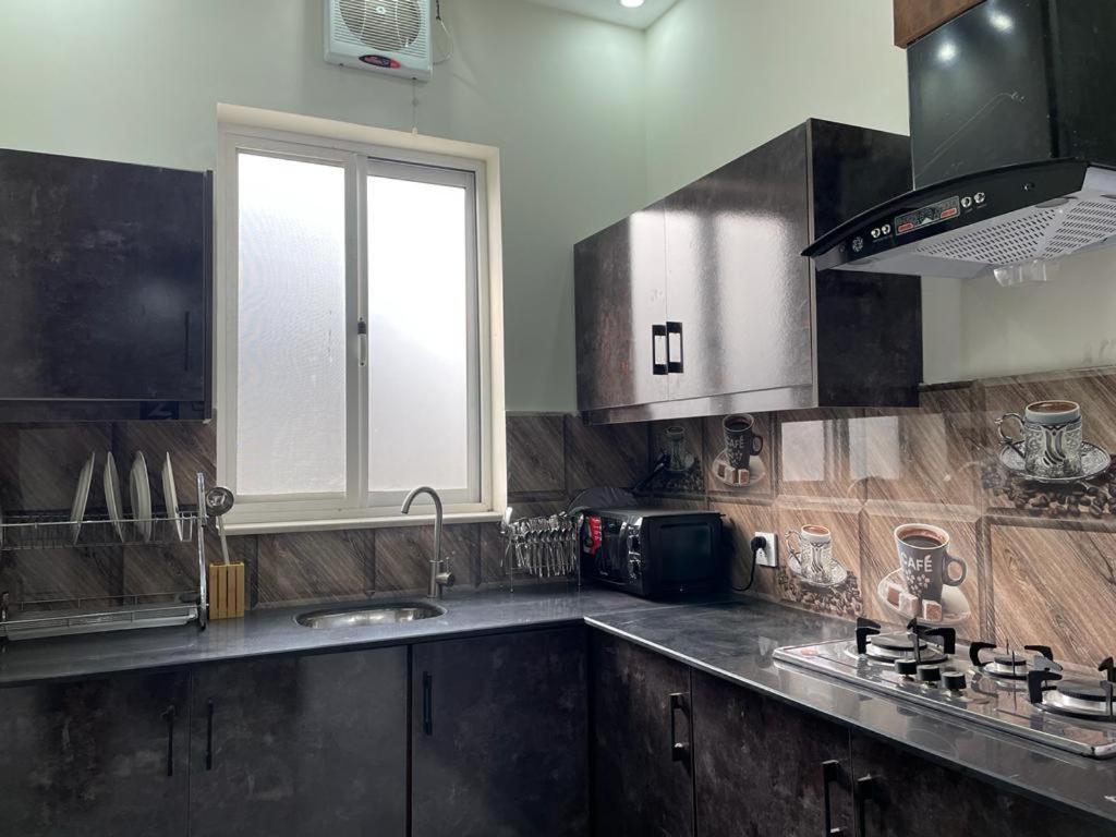 Spacious 3 Bedroom Stay DHA Lahore view 4