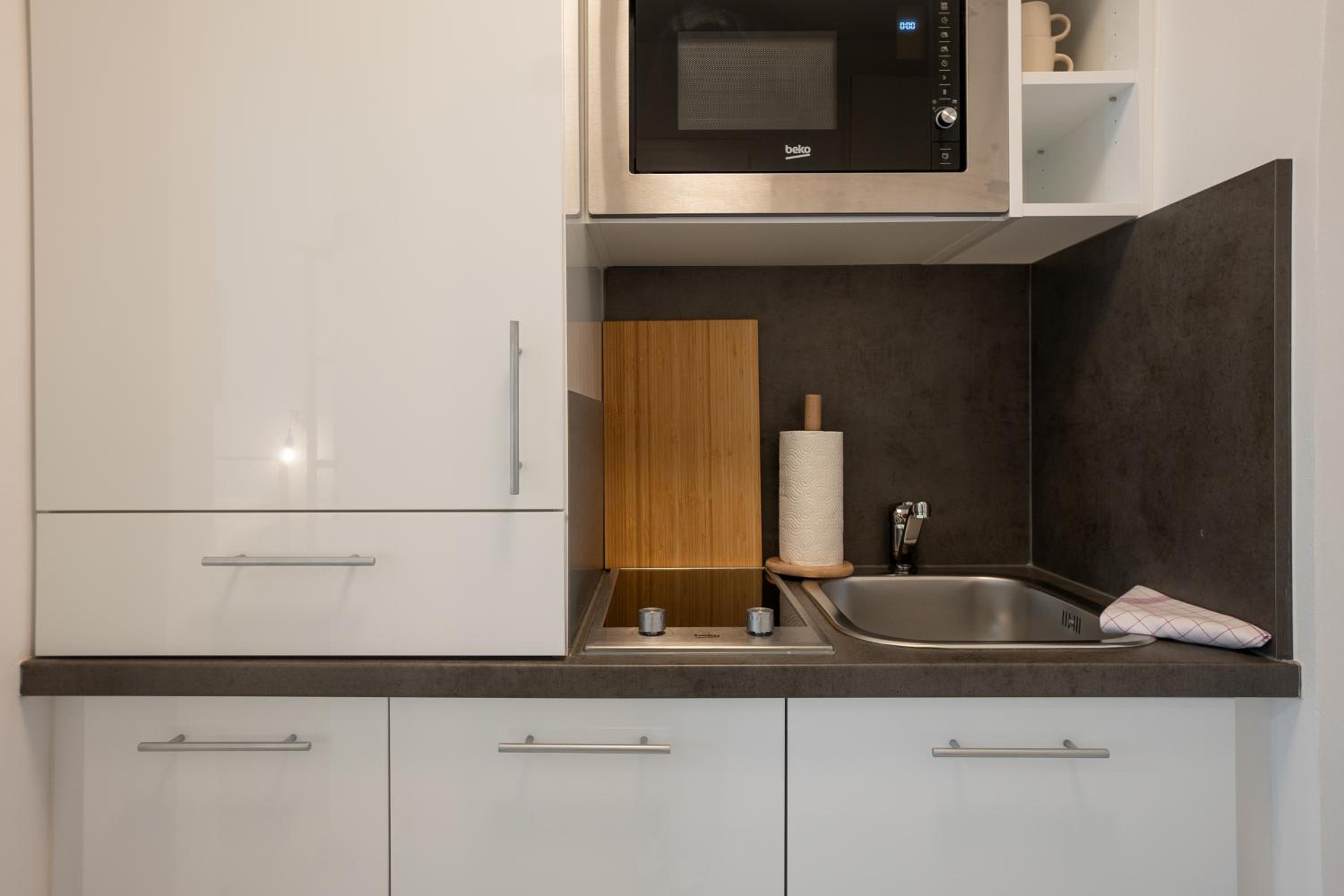 Bright and cozy studio with a city view