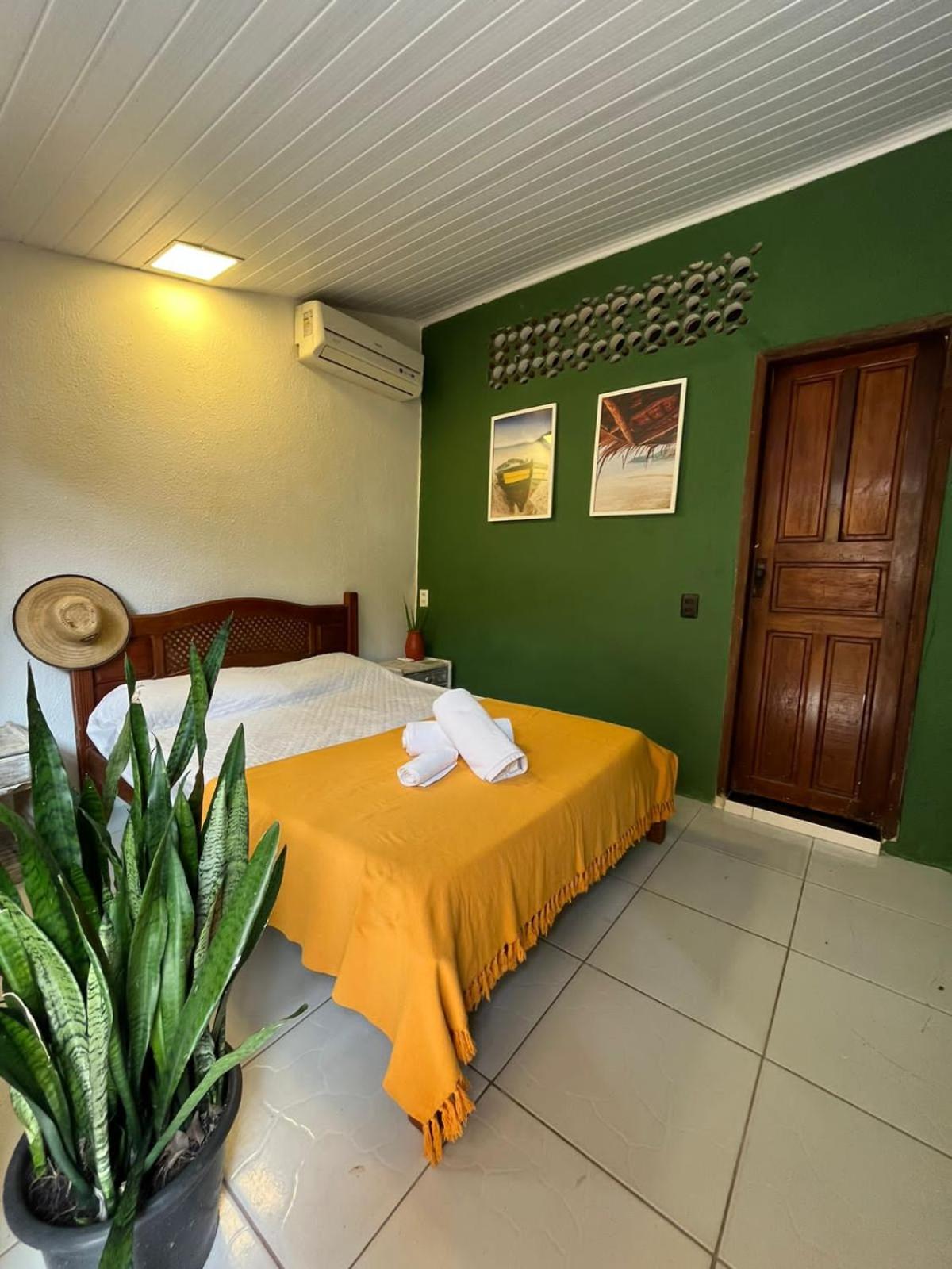 Casa Mukau pé na areia