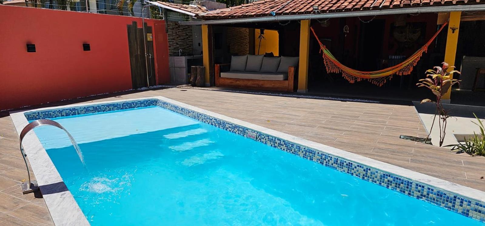 Casa Mukau pé na areia