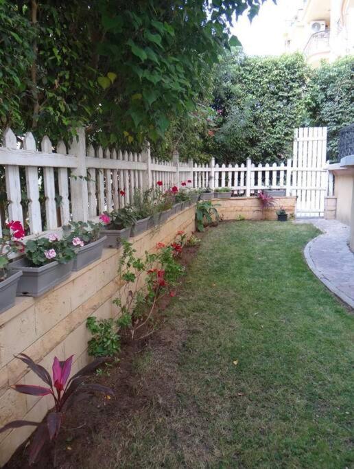 2BR Apartment with Private Garden in Downtown Rehab Near Malls