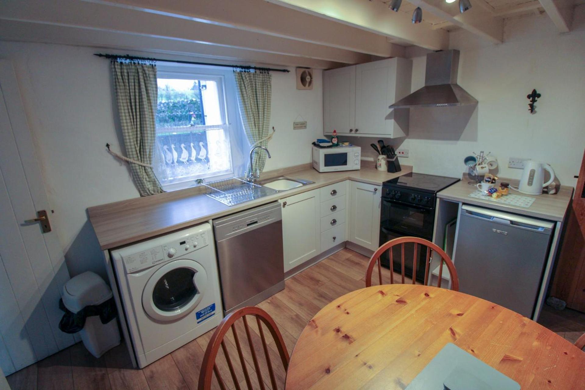 Greenside Cottage traditional cottage overlooking Caldbecks duck pond