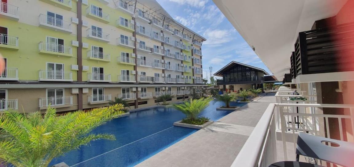 Amani Grand Resort Residences by JC SpaceRentals balcony pool view, Ground floor, 5mins from airport, free WIFI, NETFLIX view 3