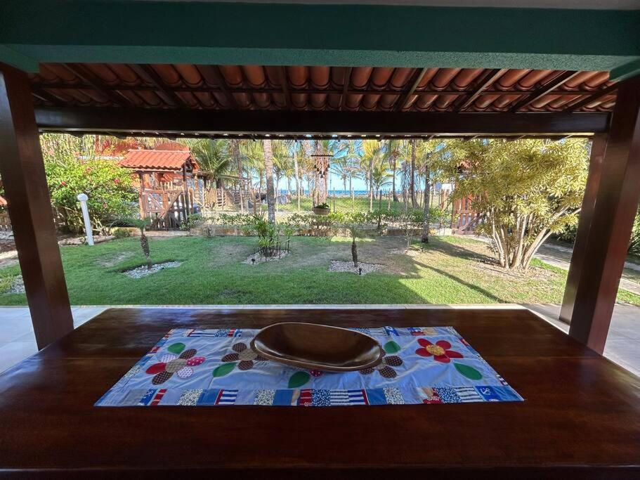Casa de praia pé na areia: nos braços da natureza.