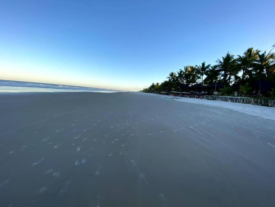 Casa de praia pé na areia: nos braços da natureza.