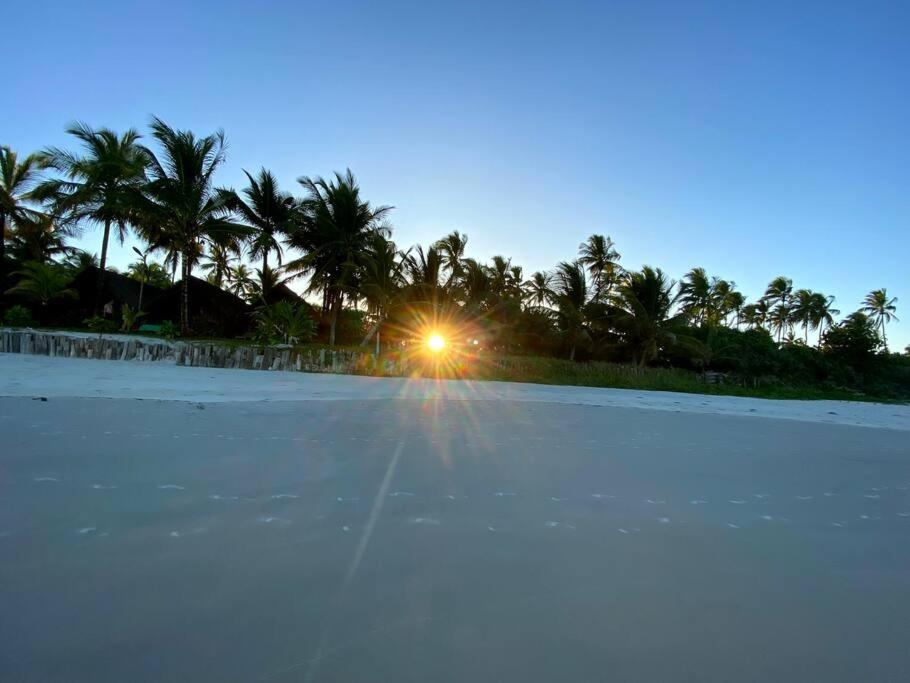 Casa de praia pé na areia: nos braços da natureza.