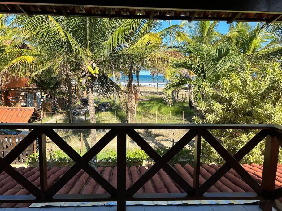 Casa de praia pé na areia: nos braços da natureza.