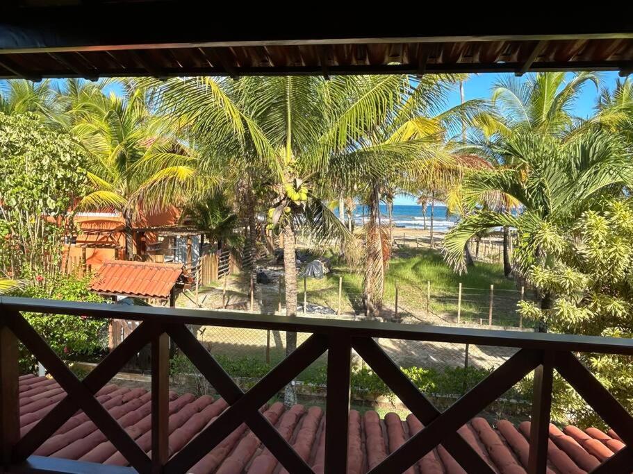 Casa de praia pé na areia: nos braços da natureza.