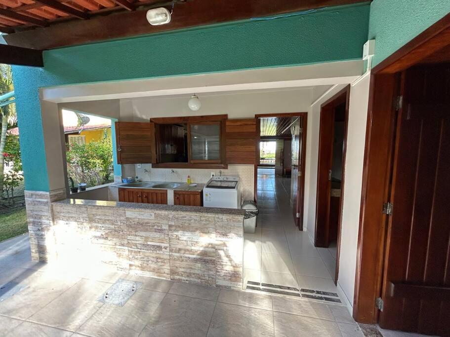 Casa de praia pé na areia: nos braços da natureza.