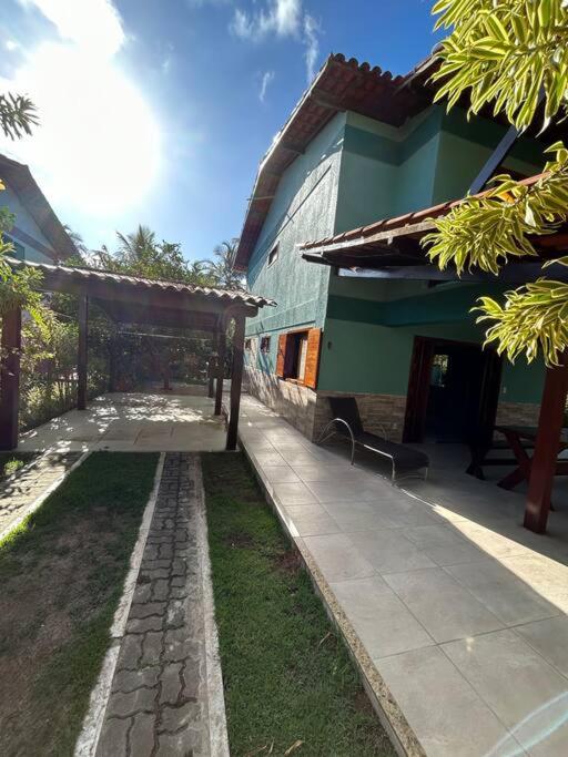 Casa de praia pé na areia: nos braços da natureza.