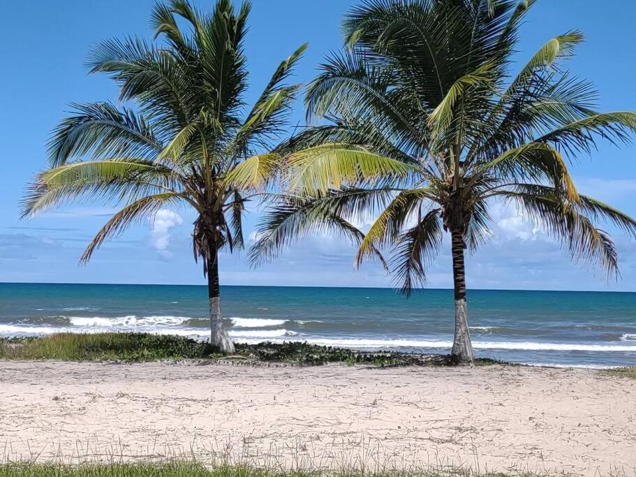 Casa de praia pé na areia: nos braços da natureza.