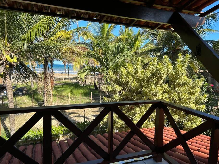 Casa de praia pé na areia: nos braços da natureza.