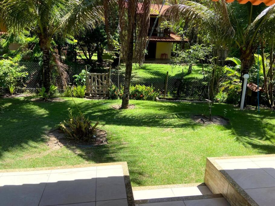 Casa de praia pé na areia: nos braços da natureza.