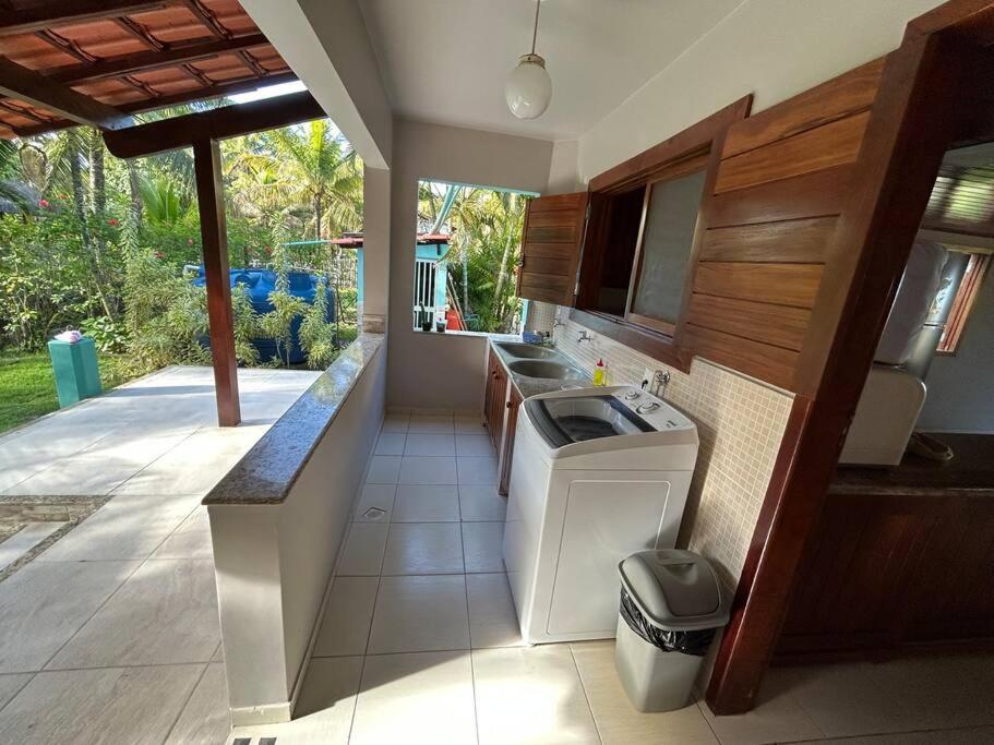 Casa de praia pé na areia: nos braços da natureza.