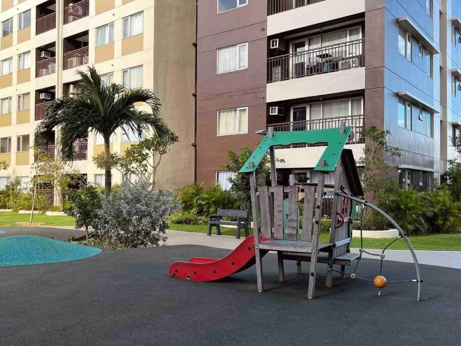Stylish Iloilo condo w/ Netflix and pool access view 3