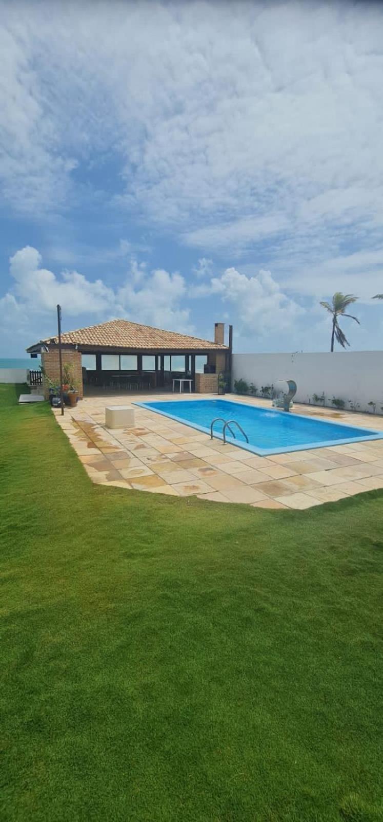 Casa Medalhão Pé na Areia
